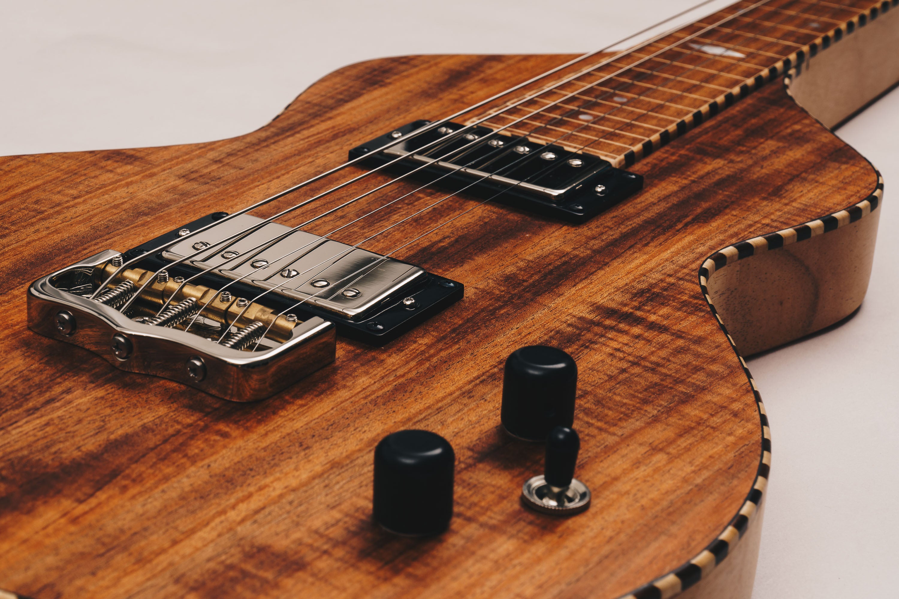 Electric Lapsteel featuring Tasmanian Blackwood top, Seymour Duncan humbuckers, Schroeder bridge, volume and tone controls.