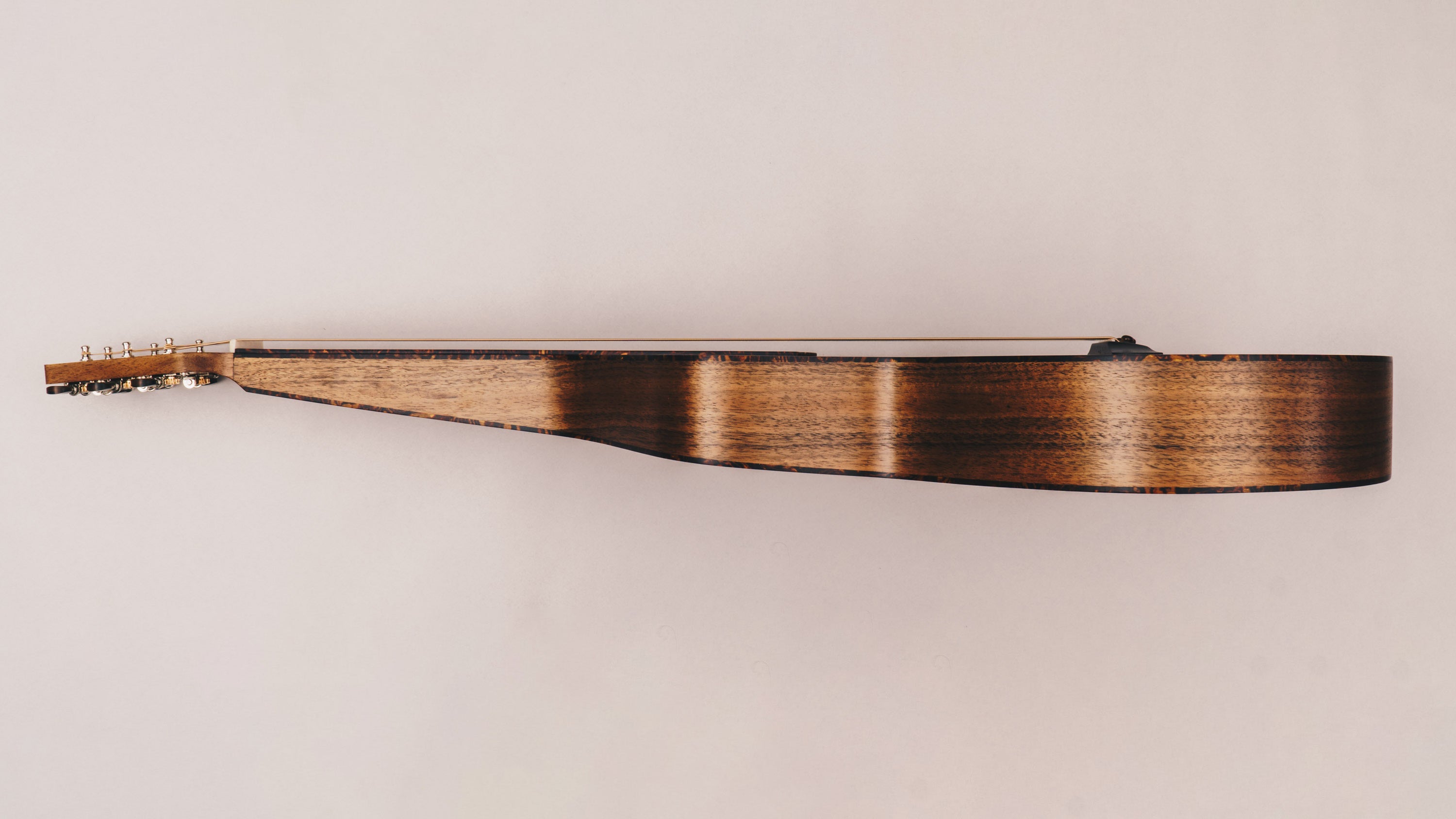 Style 2 Weissenborn guitar featuring tortoiseshell binding, tuning machines and bridge pins by Richard Wilson.